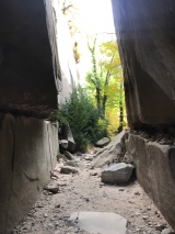 <p>																																		Going through the Entrance or Portal between to massive and huge limestone cliffs</p>